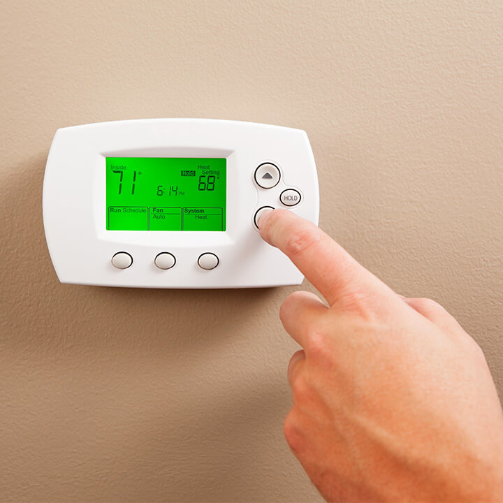 upgrade or program your thermostat to save on energy bills