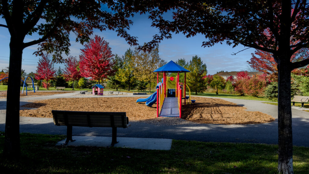 playground around an apartment building in the fall