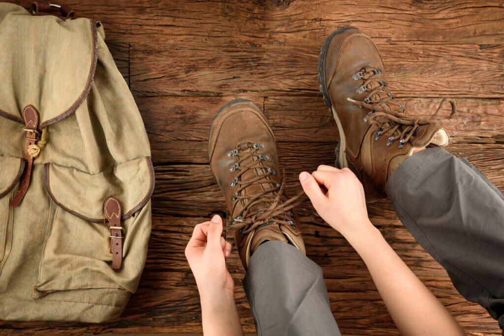 person tying their boot