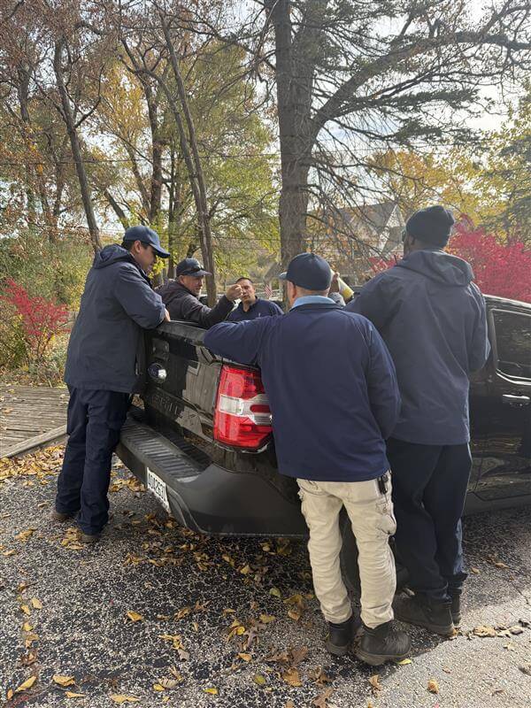 The team strategizing about how to tackle cleaning this home in the most efficient way.