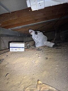 Even in a crawlspace, the team was all smiles and all thumbs up for helping Ms. Alice.